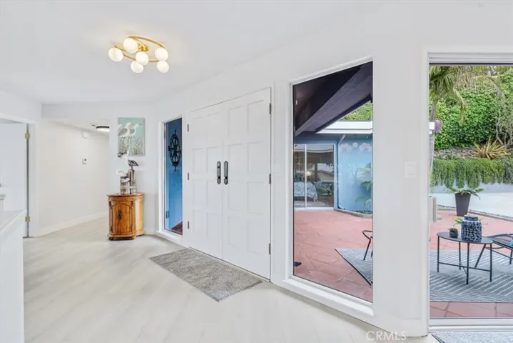 Entry foyer, new lighting, paint, floors.