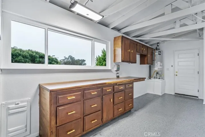 Gorgeous workbench and a 2nd fridge will be included for this space