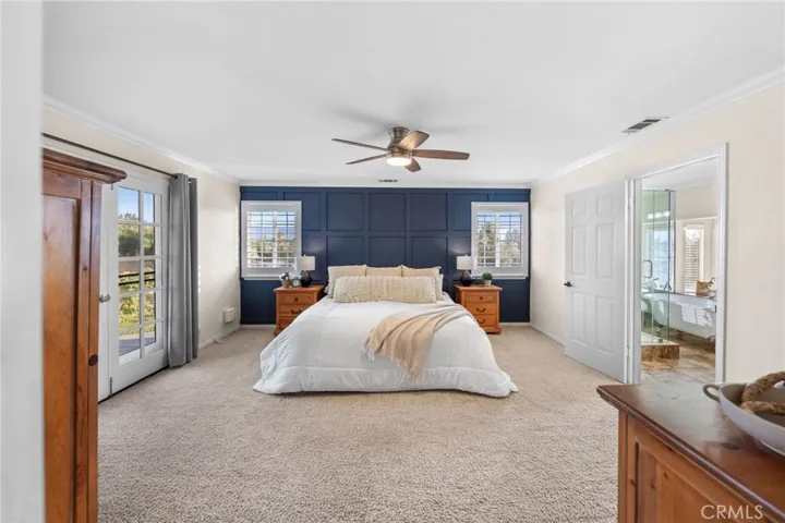 Primary bedroom with access to the front yard