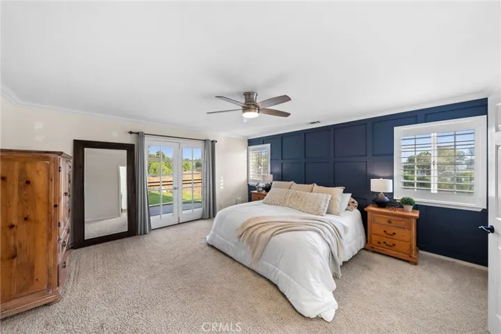 Primary bedroom with access to the front yard
