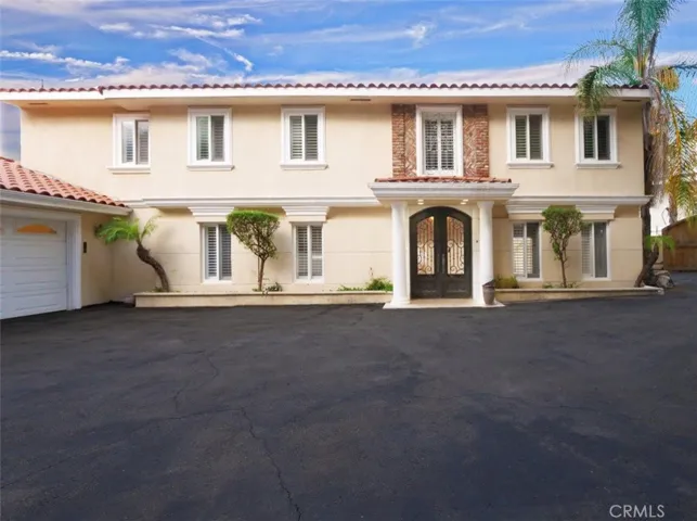 Private motor court and front of the house