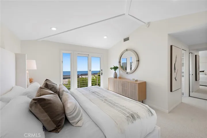 Main floor primary suite with ocean views