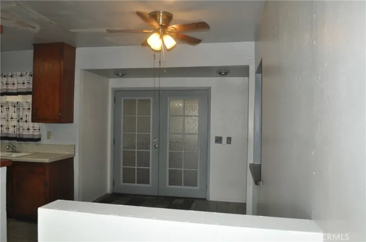Living room view to Kitchen and Indoor Patio
