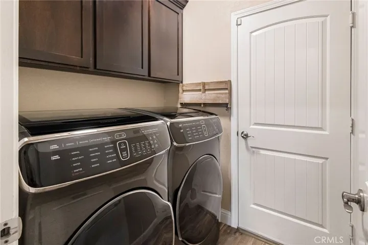 Indoor laundry room with garage access.