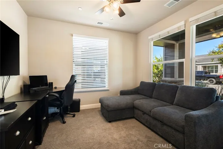 Den/bonus space with double french door entry.