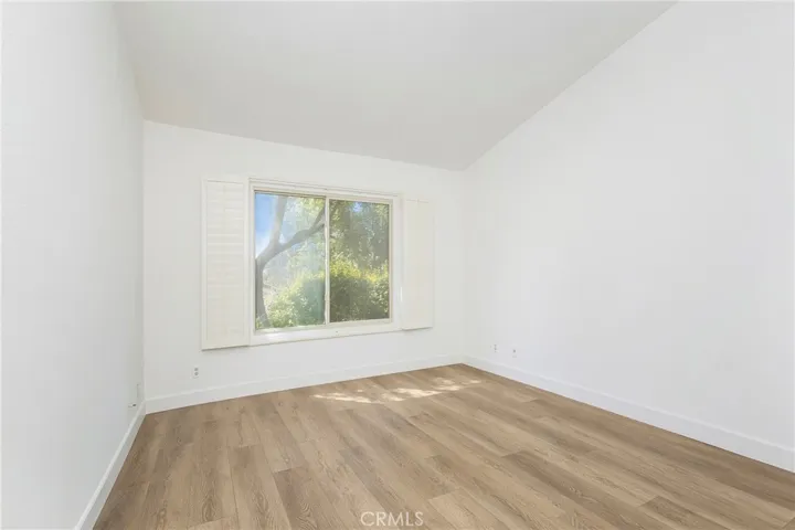 Primary Bedroom with window over looking backyard