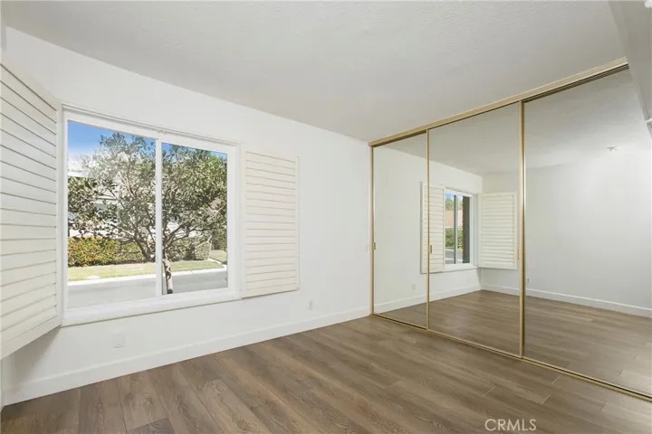 Bedroom #1 with plenty of closet space and window over looking front yard