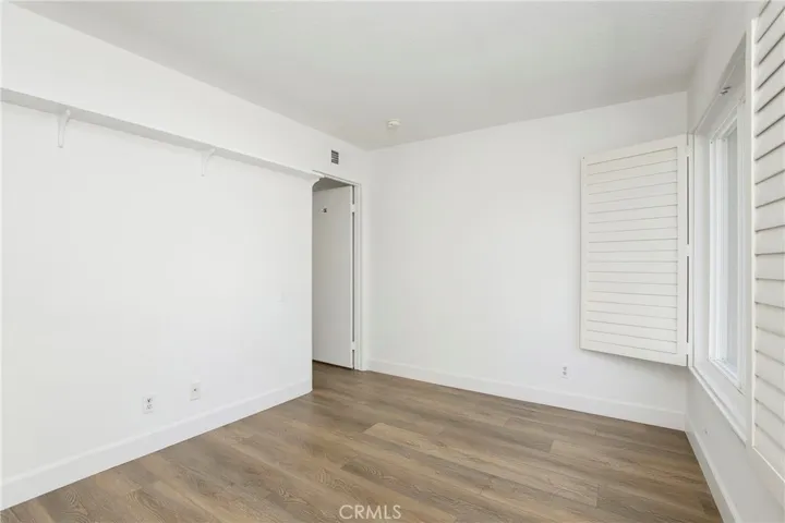Bedroom #1 - Spacious with plantation shutters, window overlooks front yard