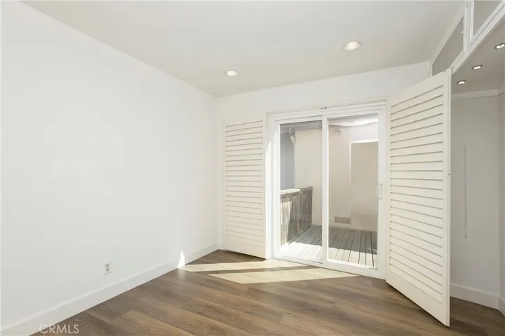 Bedroom #2 with Sliding door access to side yard patio area