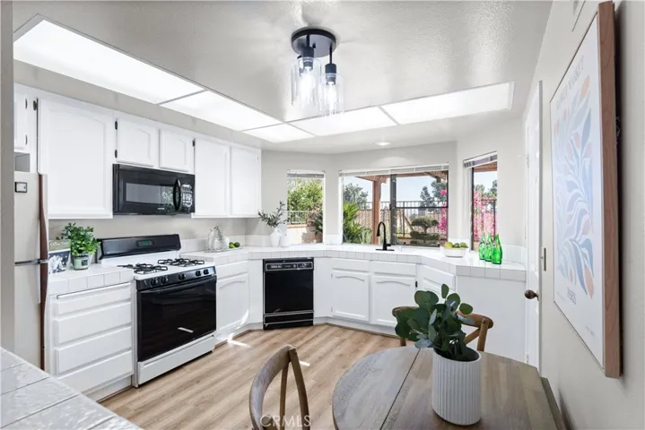 Open concept kitchen with nook area and open to family room