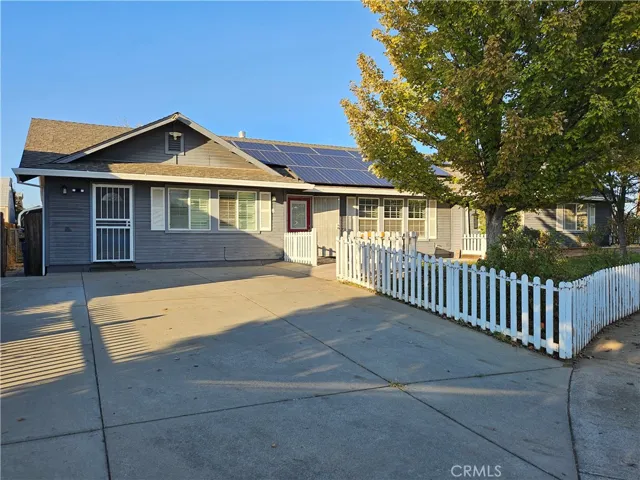 Driveway looking at home with solar on roof