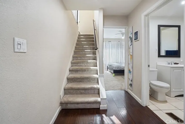 The stairs are in the middle of the home.