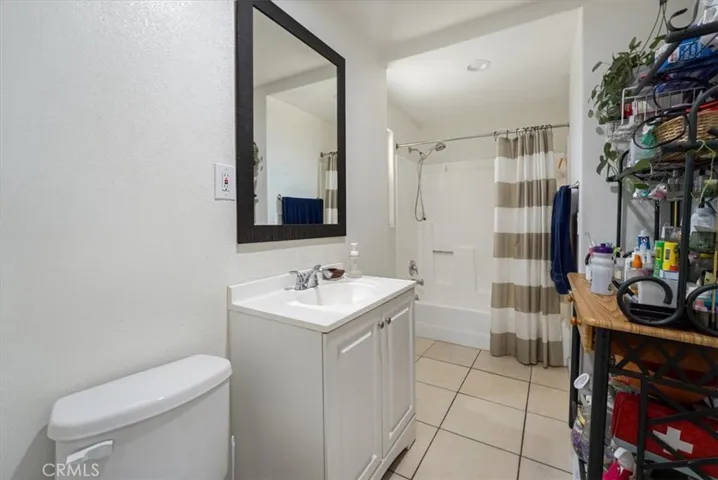 The full bathroom downstairs has a bathtub/shower combination and plenty of space for extra storage.