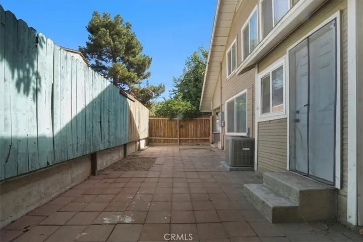 The side yard door to the right leads you into the dining area.