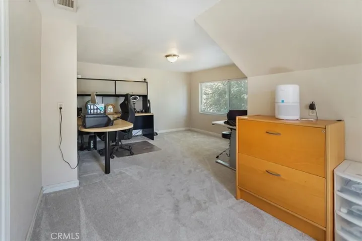 Bedroom 4 is very roomy and has an extra large window that overlooks the front yard.