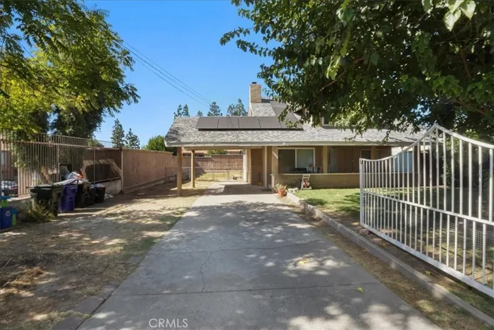 There is plenty of parking on the large driveway that leads to the covered carport.
