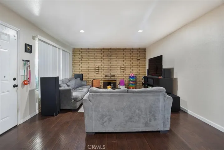Stepping into the home the wall to wall fireplace in the living room is an attractive centerpiece.