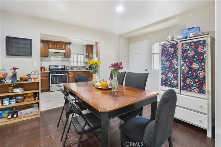 The dining room is in the middle of the home with a door that enters into the side yard.