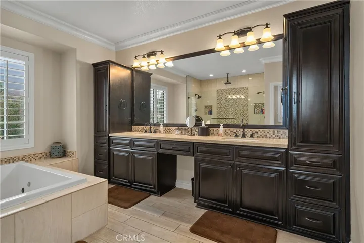 Dual vanities with lots of storage in primary suite