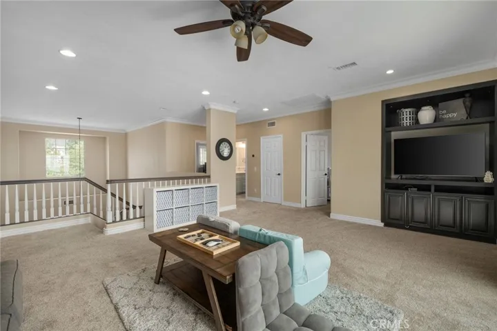 Loft has ceiling fan and built-ins