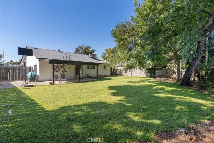 Patio, backyard, RV parking to the left