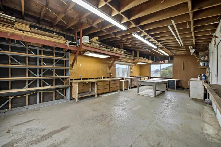 30x15 2-story workshop. Tons of open workshop space on top, and tons more of shelved storage space on the lower level.