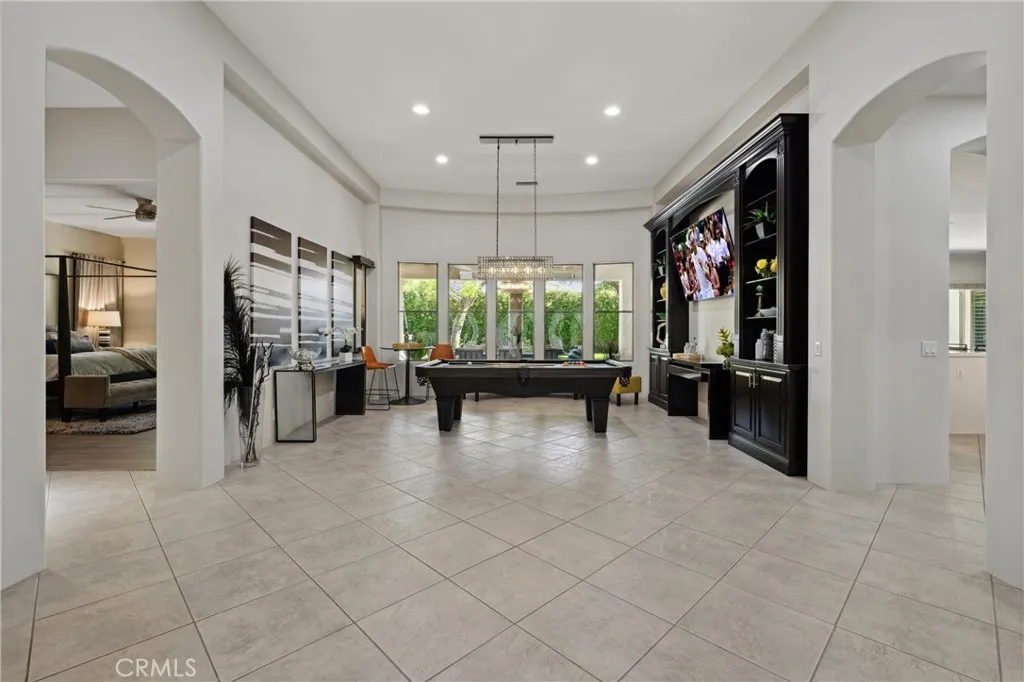 Pool table and gaming area with barstools Pool table and gaming area with barstools