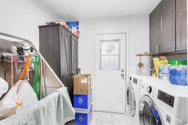 Laundry room and door to the cars