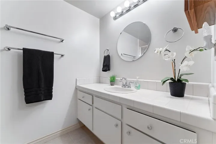 Welcome to the bathroom suite of the 1 of two primary suites.