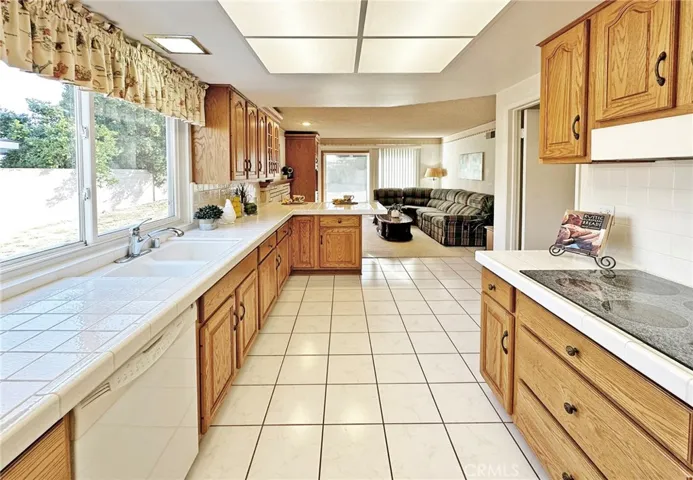 Kitchen with Tile Floor & Counters, Electric Cooktop, Double Ovens, Dishwasher, Beautiful Cabinetry