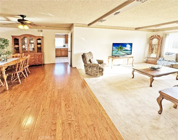 Hardwood Flooring Extends from Foyer to Elegant Formal Dining Room