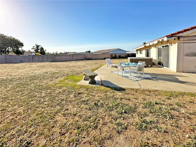 Gigantic Backyard with Wrap-Around Concrete Patio