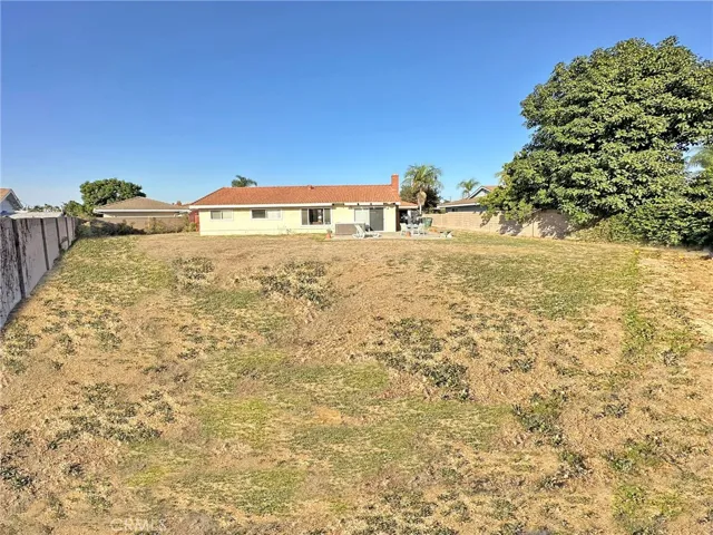 GIANT Backyard with Block Wall Fencing is Waiting for your Future Plans