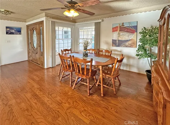 Formal Dining Room with Ceiling Fan and Foyer with Custom Front Door