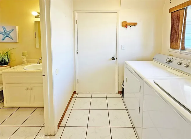 Just off Kitchen is an Inside Laundry Room and a Half Bath, Plus Direct Access to the 3 Car Garage