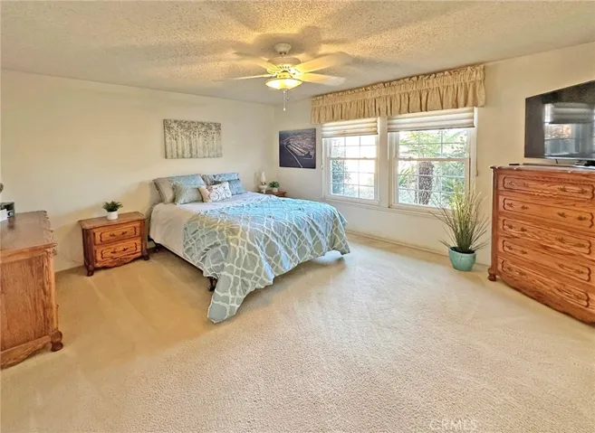 Extra Large Primary Suite with His & Hers Closets, Sit-Down Vanity Counter, and Ensuite Bathroom with Walk-In Shower