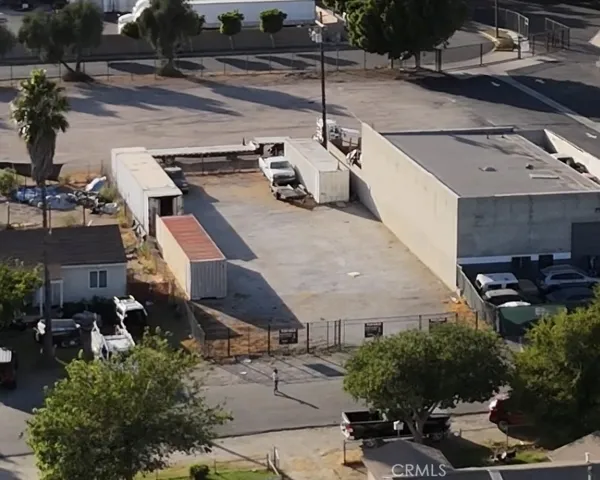 Zoomed out showing house and body shop neigboring property