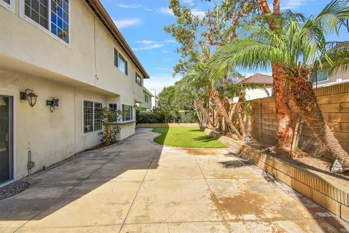 Built in planters with fruit trees and private block-wall fencing
