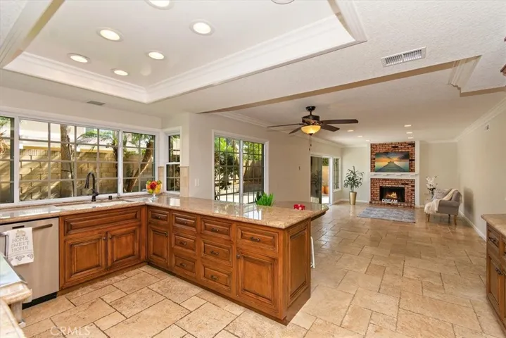 The gorgeous kitchen opens seamlessly into a spacious family room, creating a perfect setting for entertaining and relaxation