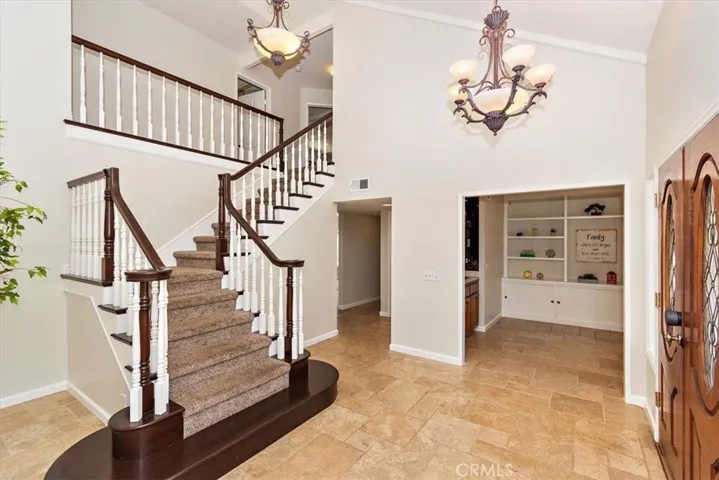  A striking spiral staircase serves as a focal point, showcasing elegant and impressive architecture