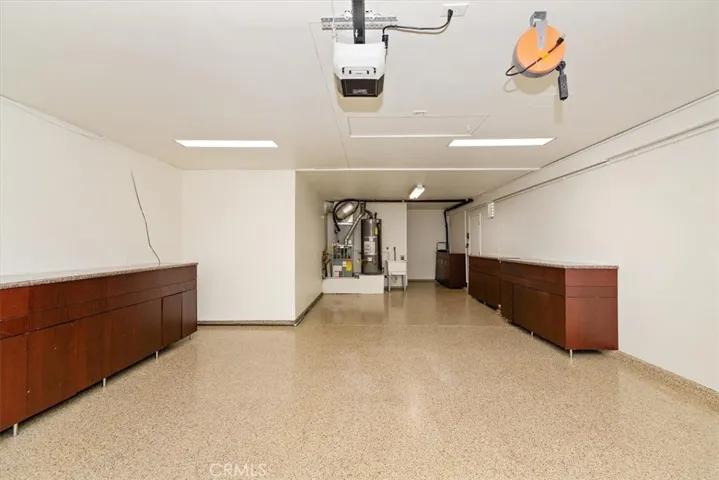 Spacious tandem 3rd car garage space next to the den and laundry room
