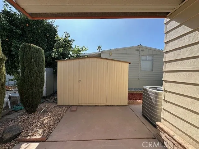Back of Covered patio showing Shed.
