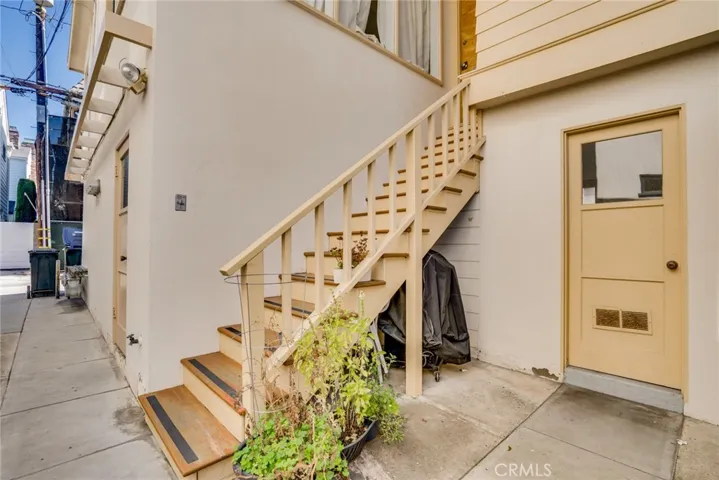 Staircase to Unit 3 and laundry room door