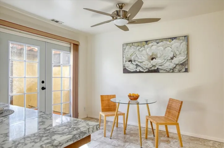 Doors lead to private patio and garage.