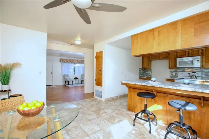 Dining Area w/ Ceiling Fan Light Fixture
