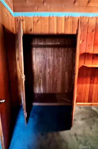 open closet of second bedroom