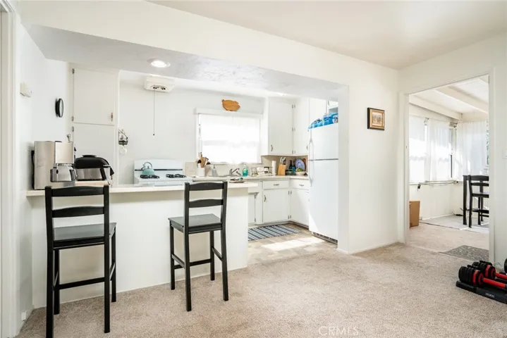 Unit 3-View of kitchen and sunroom/bonus room to right