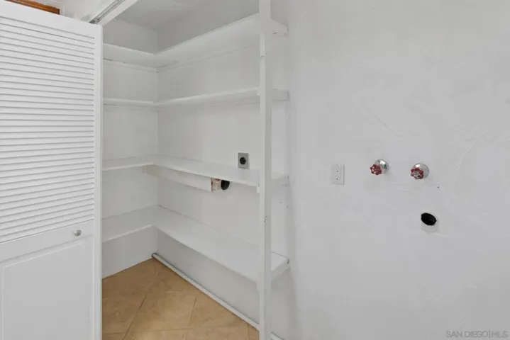 Washer and dryer hook-ups conveniently located in the kitchen pantry/closet.