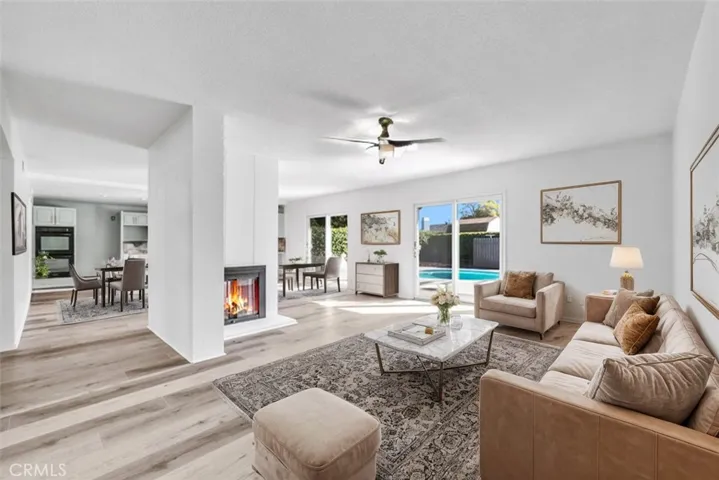 Living Room open to pool Dining Double sided Fireplace