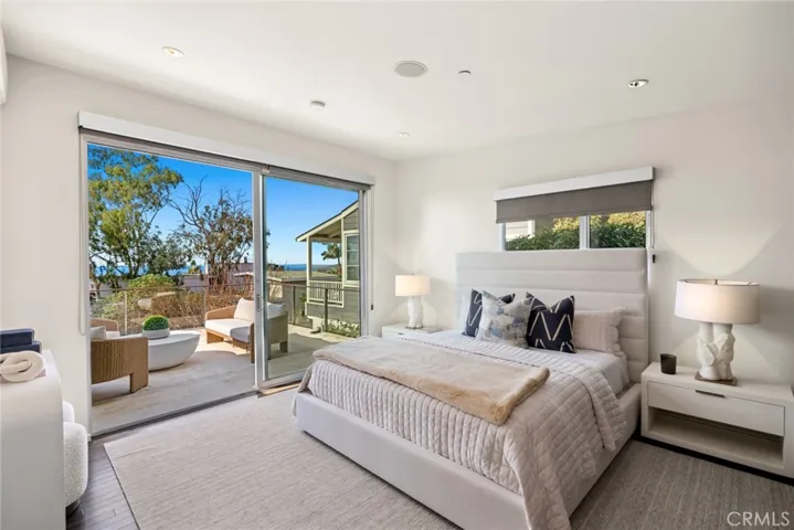 Refresh stylishly in the home’s luxurious primary suite, which is appointed with a spacious fireplace-warmed deck, and a spa-inspired bath with vessel sinks and lacquered wood cabinets.